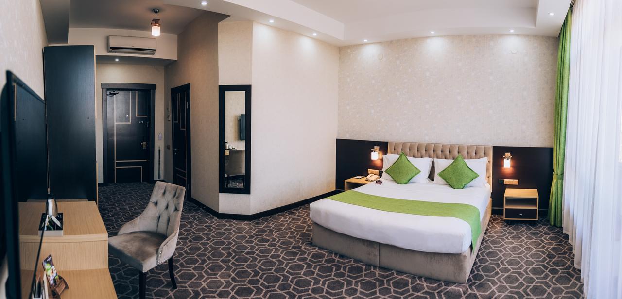 Megapolis Hotel Simkent Buitenkant foto